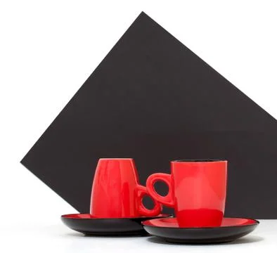 Red coffee cups on a black background Stock Photos