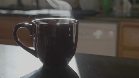 Red Coffee Mug Steaming On Quartz Countertop Video stock 100680601