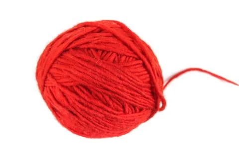 Red coiled ball of knitting thread with an open thread on a white background Stock Photos