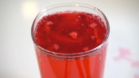Red cokatail red water bubble in a glass close up Video stock 108983702