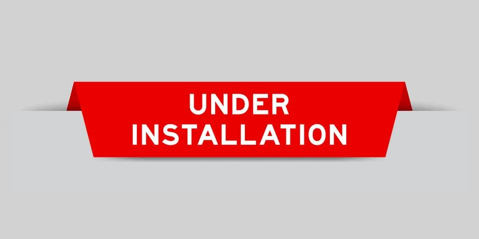 Red color inserted label with word under installation on gray background 스톡 일러스트