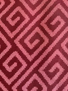 Red color of shape pattern on carpet Stock Photos