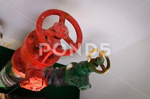 Red color ship valve and green ship valve. Metals, maritime, seaway ...