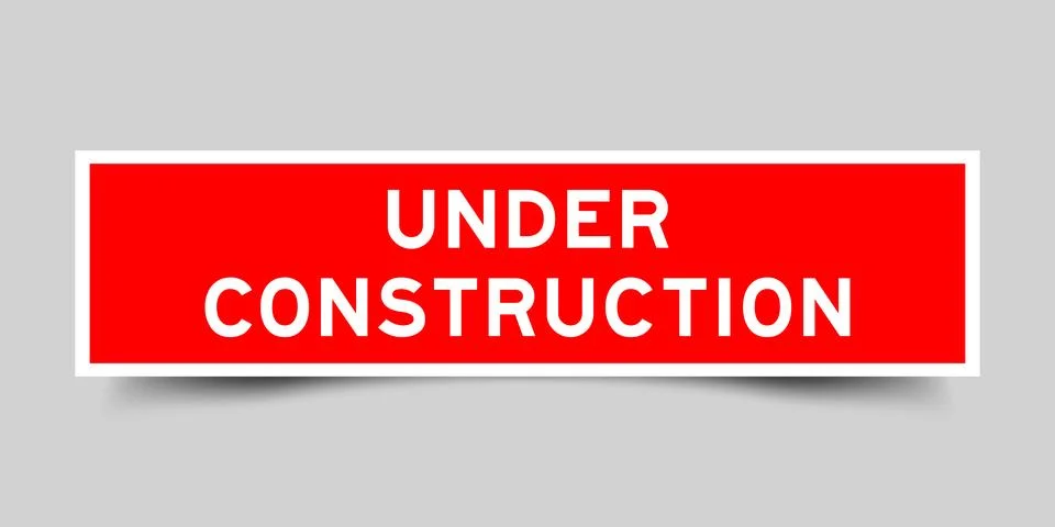 Red color square shape sticker label with word under construction on gray b.. Stock Illustration
