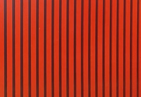Red color straight line pattern texture. Bright red background with black s.. Stock Photos