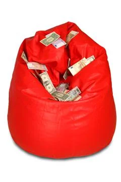 Red colored bean bag with assorted currency notes Stock Photos