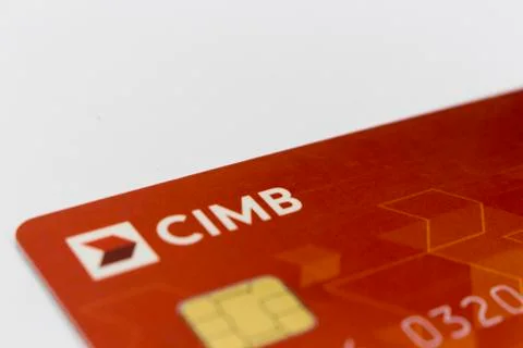 Red colored cimb master card isolated in white background. Stock Photos