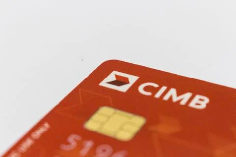 Red colored cimb master card isolated in white background. Stock Photos