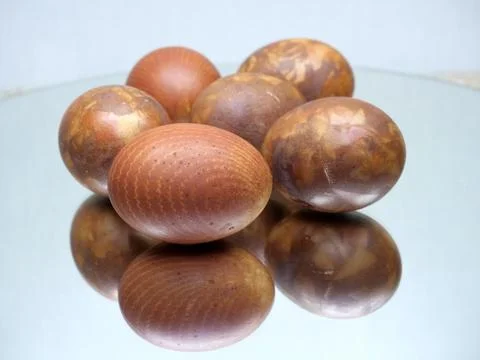 Red colored Easter eggs with marble pattern isolated on white background Stock Photos