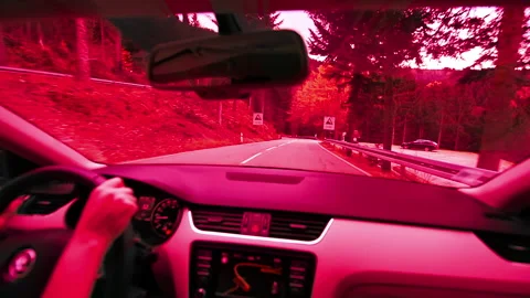 Red colored footage - abstract vision from inside the car of person driving on a 動画素材 147104655