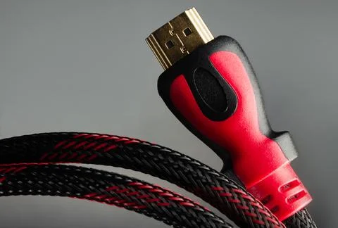 Red colored hdmi cable close-up. Stock Photos