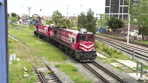 RED COLORED LOCOMOTIVE IS GOING ON THE ROAD ALONE Stock Footage 238615280