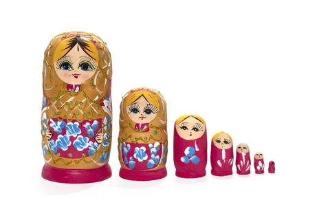 Red colored nesting dolls on a white background. Russian national souvenir 스톡 사진