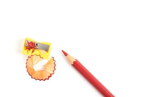 Red colored pencil with sharpener isolated on white background Stock Photos