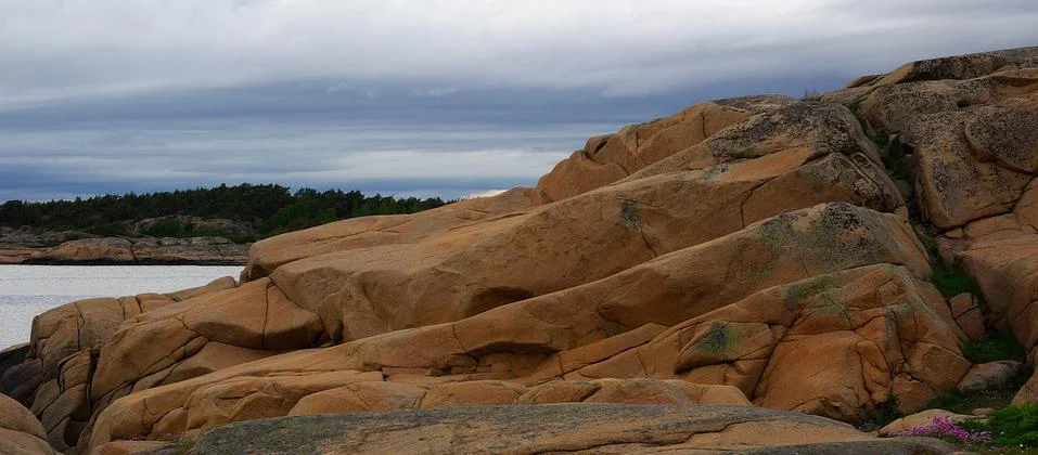Red colored rocks Stock Photos