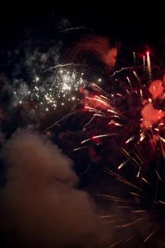 Red colorful Firework exploding in the sky for anniversary Stock Photos