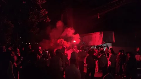 Red coloured light torch glows at a Ramadan festival Stock Footage 276742428