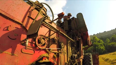 Red Combine Driving In Wheat Field Stock Footage 140281305