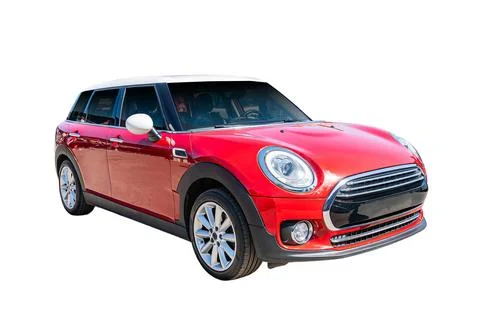 Red compact car on white background, sleek modern design, prominent front g.. Stock Photos