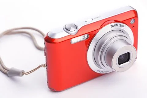 Red compact zoom digital camera over white Stock Photos