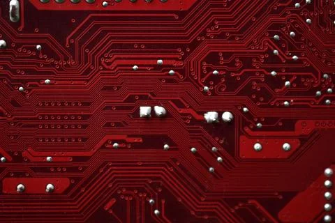 Red computer motherboard chip close-up with elements 스톡 사진