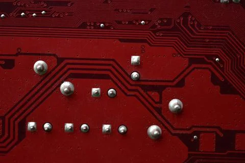 Red computer motherboard chip close-up with elements 스톡 사진