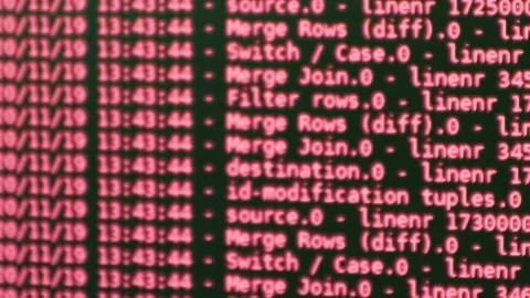 Red computer software code moving on a black monitor reflect on glass defocus Stock Footage 144046702