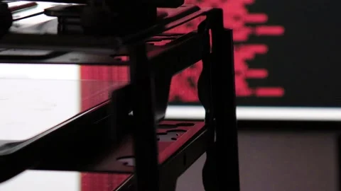 Red computer software code moving on a black monitor reflect on glass. Abstra 스톡 동영상 144049593