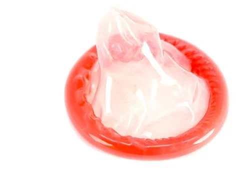 Red condom isolated on white background, Having safe sex for Valentine's Day, Stock-Fotos