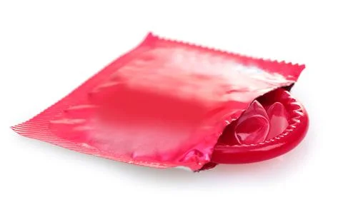 Red condom with open packing isolated on white Stock Photos