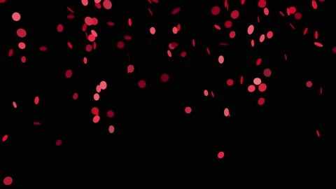 Red confetti are falling like rain on a black background, iridescent. Stock Footage 223170278