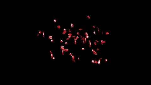 Red Confetti explodes on a black background Stock Photos