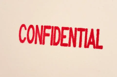 Red confidential stamp on a folder Stock Photos