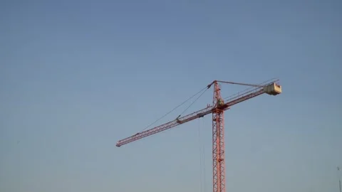 Red construction crane on blue sky Stock Footage 280270251