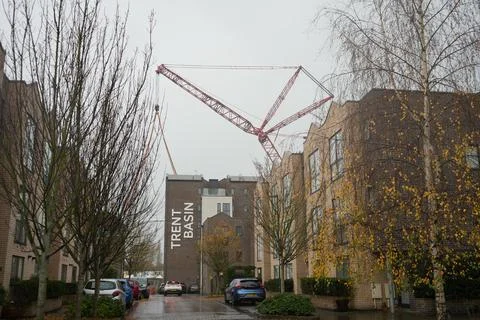 Red Construction Crane Over Modern Buildings At Trent Basin, Nottingham On Stock Photos