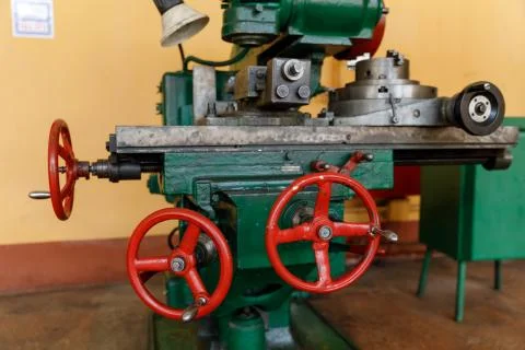 Red controls of the Universal old and green Milling Machine Stock Photos