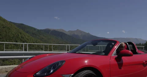 Red Convertible Cabriolet Driving on Open Country Road Stock Footage 159346987
