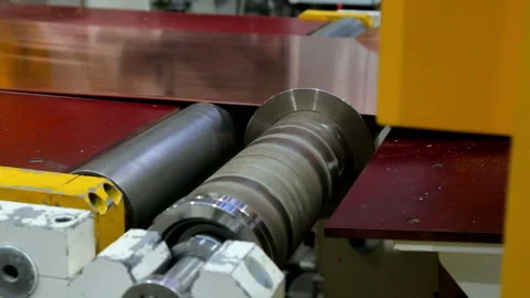 Red copper sheet tape is fed to the close-up cutting line Stock-Footage 103848387