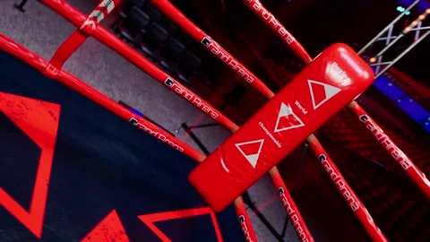 Red corner of empty boxing arena in the light of a spotlight 4k video footage Stock Footage 152731505