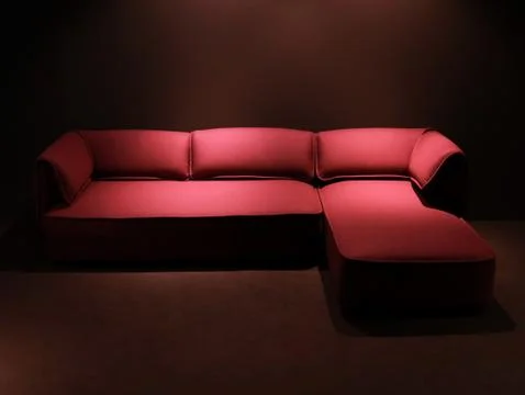 Red corner sofa Stock Photos
