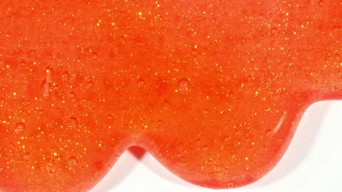 Red Cosmetic Gel Fluid With Molecule Bubbles Flowing On The Plain White Stock Footage 276994075