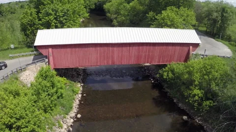 Red Covered Bridge with Grey Car Entering Stock Footage 63873387