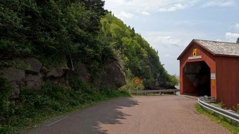 Red covered bridge at Point Wolf in Fundy National Park New Brunswick Canada Stock Photos