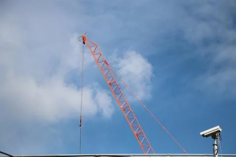 Red crane the construction machine build with the CCTV Fotos Stock