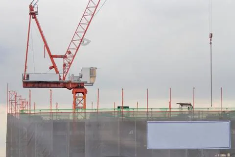 Red crane is under construction. Stock Photos