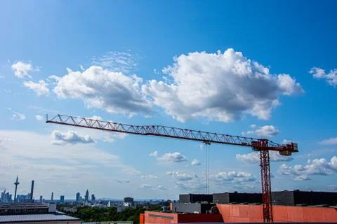 Red crane working to create new building Stock Photos