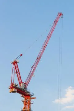 Red crane working. Stock Photos