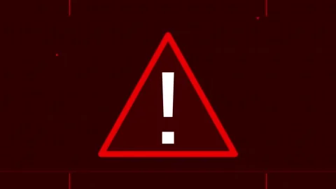 Red critical error message showing flashing warning triangle sign on dark Stock Footage 345952776