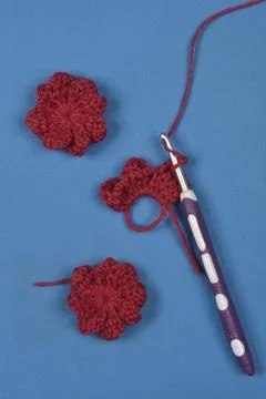 Red crocheted flowers Stock Photos