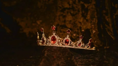 Red crown with red gems isolated on black background Stock Footage 321455817